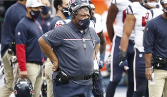 Houston Texans interim head coach Romeo Crennel watches from the sideline in the second half of an NFL football game against the Tennessee Titans Sunday, Oct. 18, 2020, in Nashville, Tenn. (AP Photo/Wade Payne)