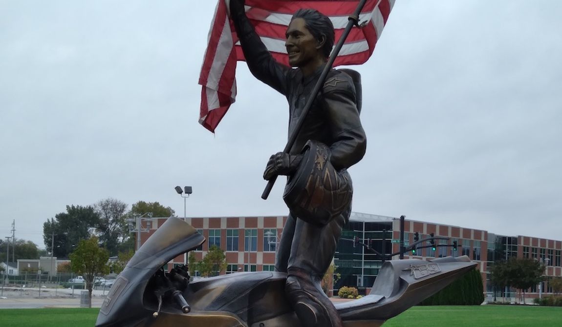 A lifesize bronze sculpture of international motorcycle racing sensation Nicky Hayden is located in his hometown of Owensboro, Kentucky. (Cheryl Chumley/The Washington Times)