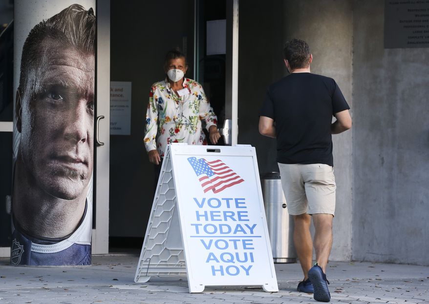 The scene with no lines and no waiting about two hours after the polls opened for early voting at Amalie Arena, Monday, Oct. 19, 2020 in Tampa. (Dirk Shadd/Tampa Bay Times via AP)