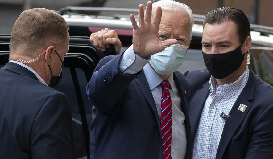 Democratic presidential candidate former Vice President Joe Biden waves as he arrives at The Queen theatre in Wilmington, Del., Monday, Oct. 19, 2020. (AP Photo/Carolyn Kaster)