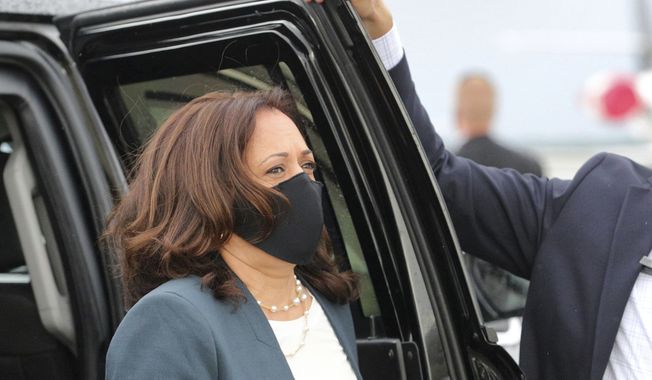 Democratic vice presidential nominee Sen. Kamala Harris, D-Calif., leaves the motorcade to walk to her plane for departure at Orlando International Airport, Monday, Oct. 19, 2020, in Orlando, Fla., after delivering remarks at an early-voting event at the Central Florida Fairgrounds. (Joe Burbank/Orlando Sentinel via AP)