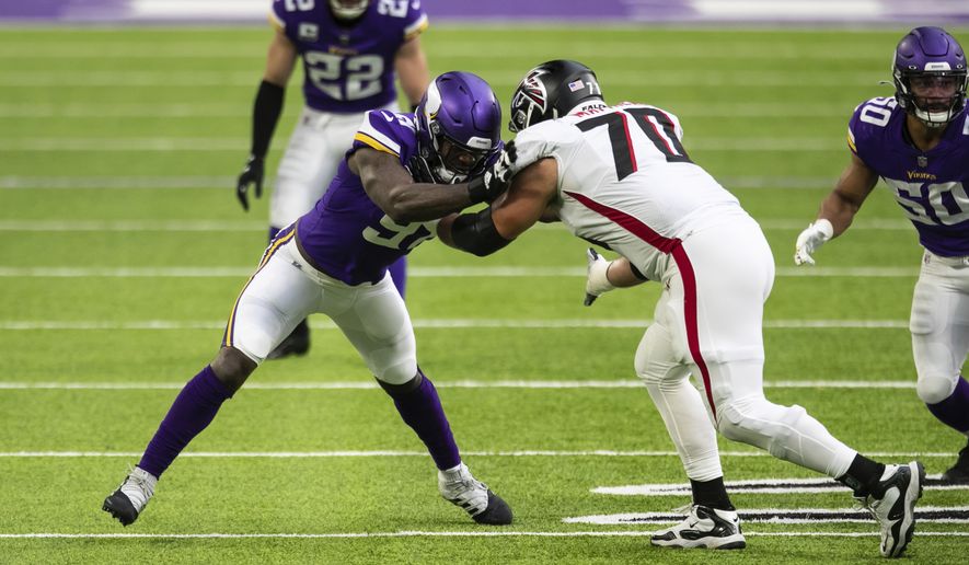 Minnesota Vikings defensive end Yannick Ngakoue (91) in action against Atlanta Falcons offensive tackle Jake Matthews (70) in the first quarter during an NFL football game, Sunday, Oct. 18, 2020, in Minneapolis. The Falcons defeated the Vikings 40-23. (AP Photo/David Berding)