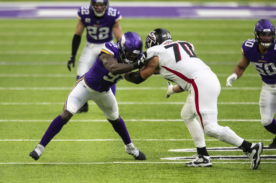 Minnesota Vikings defensive end Yannick Ngakoue (91) in action against Atlanta Falcons offensive tackle Jake Matthews (70) in the first quarter during an NFL football game, Sunday, Oct. 18, 2020, in Minneapolis. The Falcons defeated the Vikings 40-23. (AP Photo/David Berding)