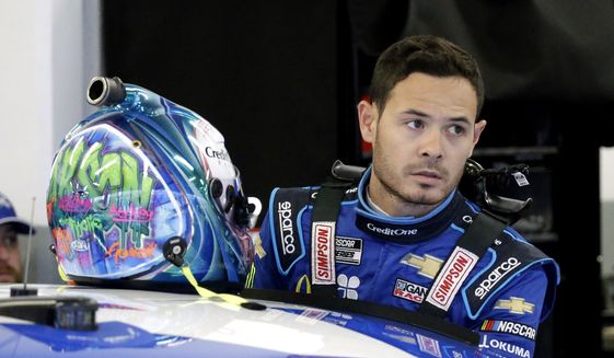  In this Feb. 14, 2020, file photo, Kyle Larson gets ready to climb into his car to practice for the NASCAR Daytona 500 auto race at Daytona International Speedway in Daytona Beach, Fla. NASCAR on Monday, Oct. 29, 2020, cleared Larson to return in 2021, ending his long suspension for using a racial slur while playing a video racing game.  Larson was suspended in April after he used the n-word while playing an online racing game in which viewers could follow along. (AP Photo/Terry Renna, File)  **FILE**