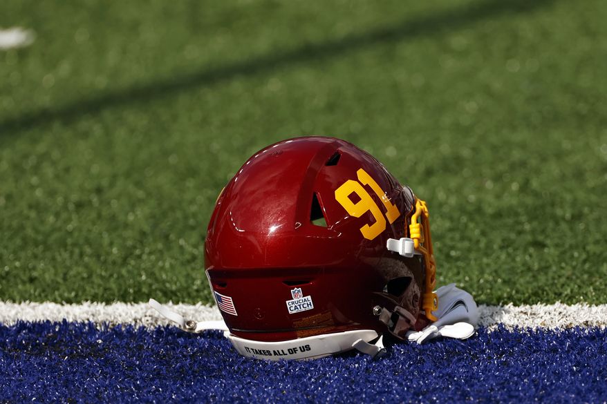 A detail shot of the helmet of Washington Football Team defensive end Ryan Kerrigan (91) is seen before an NFL football game against the New York Giants, Sunday, Oct. 18, 2020, in East Rutherford, N.J. (AP Photo/Adam Hunger)