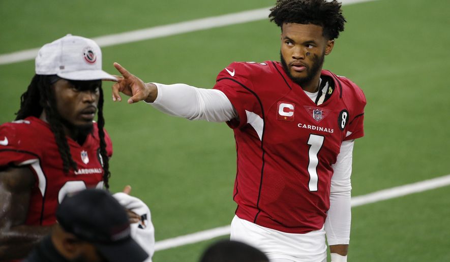 Arizona Cardinals' Kyler Murray (1) waves to fans in the stands in the first half of an NFL football game against the Dallas Cowboys in Arlington, Texas, Monday, Oct. 19, 2020. (AP Photo/Michael Ainsworth)