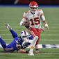 Kansas City Chiefs quarterback Patrick Mahomes (15) evades Buffalo Bills&#39; Justin Zimmer during the second half of an NFL football game, Monday, Oct. 19, 2020, in Orchard Park, N.Y. (AP Photo/Adrian Kraus)