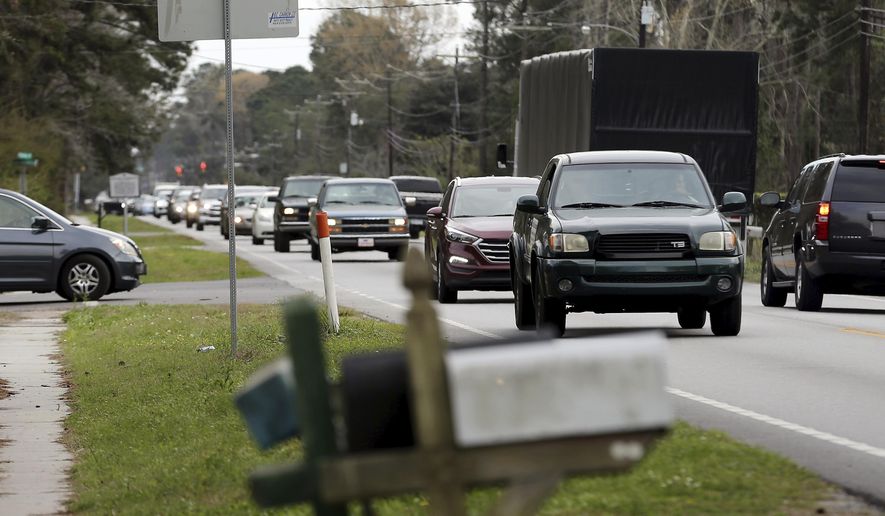 This March 5, 2018 photo shows traffic on Highway 41 in Mt. Pleasant, S.C.  Charleston County’s proposal to widen S.C. Highway 41 has drawn thousands of public comments. Some supporters call the road through the historic Black community of Phillips the cost-effective, obvious choice. Others decried it as a discriminatory plan that puts the burden on those with least political power.   (Grace Beahm Alford/The Post And Courier via AP)