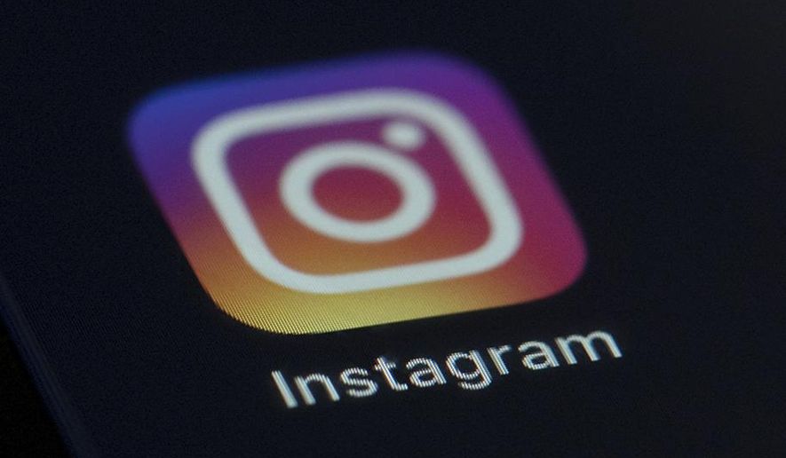 This Friday, Aug. 23, 2019, photo shows the Instagram app icon on the screen of a mobile device in New York. (AP Photo/Jenny Kane) 