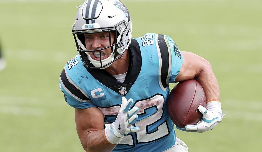 Carolina Panthers running back Christian McCaffrey (22) rushes for a touchdown against the Tampa Bay Buccaneers during the second half of an NFL football game Sunday, Sept. 20, 2020, in Tampa, Fla. The Panthers are eager to get Christian McCaffrey back on the field after he has missed four games with a high ankle sprain. (AP Photo/Mark LoMoglio)