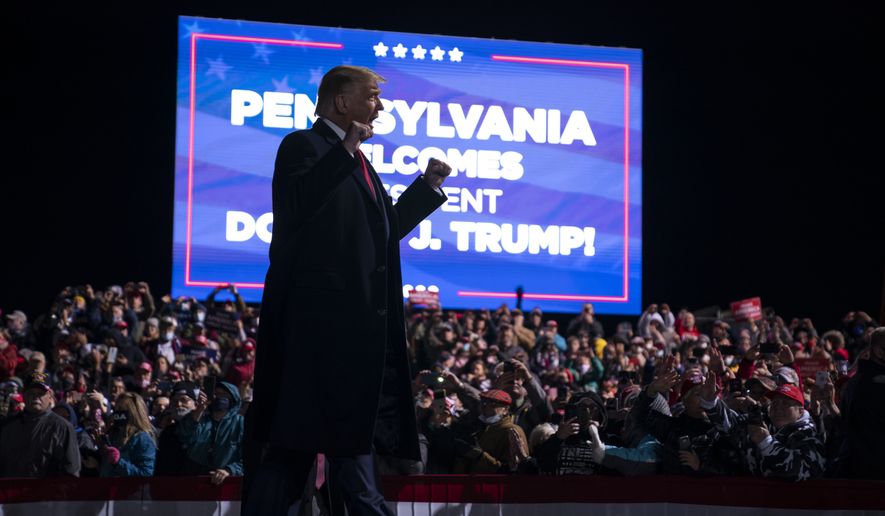 President Donald Trump arrives for a campaign rally at Erie International Airport, Tom Ridge Field, Tuesday, Oct. 20, 2020, in Erie, Pa. (AP Photo/Evan Vucci)