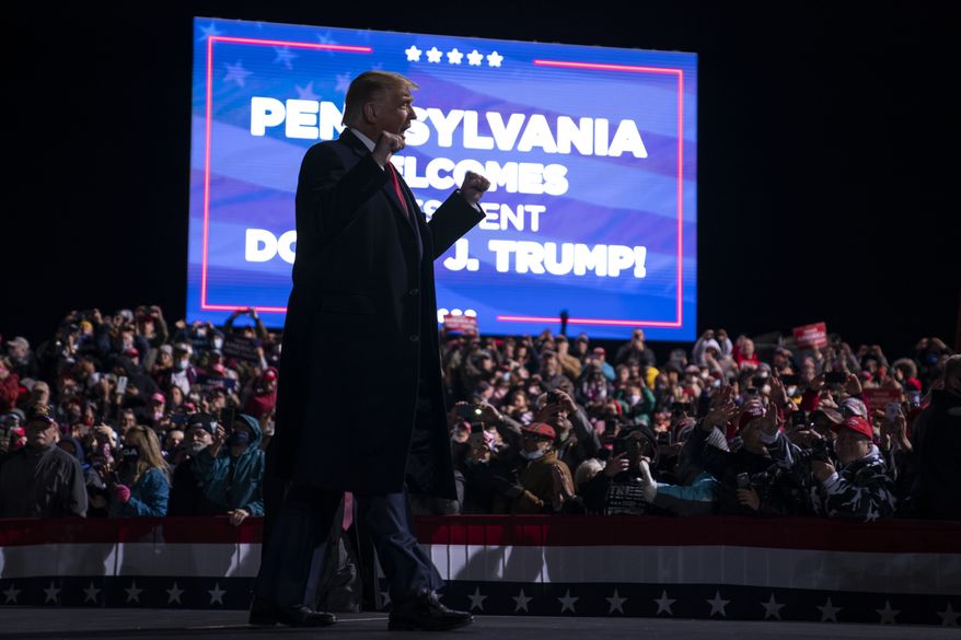 President Donald Trump arrives for a campaign rally at Erie International Airport, Tom Ridge Field, Tuesday, Oct. 20, 2020, in Erie, Pa. (AP Photo/Evan Vucci)