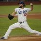 Los Angeles Dodgers starting pitcher Clayton Kershaw throws against the Tampa Bay Rays during the first inning in Game 1 of the baseball World Series Tuesday, Oct. 20, 2020, in Arlington, Texas. (AP Photo/Eric Gay)