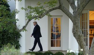 President Donald Trump leaves the Oval Office as he walks to board Marine One at the White House in Washington, Tuesday, Oct. 20, 2020, for a short trip to Andrews Air Force Base, Md., and then on to Erie, Pa. for a campaign rally. (AP Photo/Andrew Harnik)