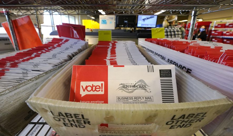 Ballots mailed-in are ready to be sorted at the King County Elections office Tuesday, Oct. 20, 2020, in Renton, Wash. Election officials there said that 280,000 county ballots had already been returned, nearly 20% of the total sent to voters. Washington state is one of five states, along with Colorado, Hawaii, Oregon, and Utah, that conduct elections entirely by mail-in voting. (AP Photo/Elaine Thompson)
