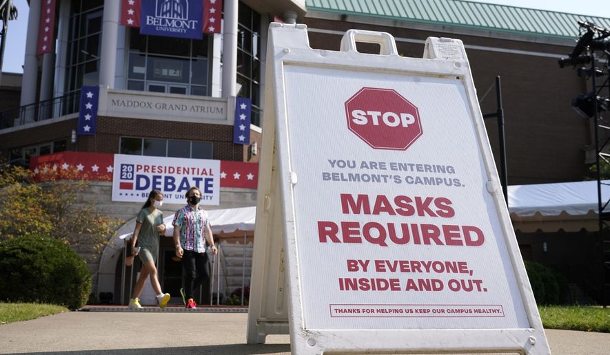 A sign greets visitors outside the Curb Event Center at Belmont University as preparations take place for the second Presidential debate, Tuesday, Oct. 20, 2020, in Nashville, Tenn., during the coronavirus outbreak. Governors of states including Tennessee, Oklahoma, Nebraska and North Dakota are all facing calls from doctors and public health officials to require masks. (AP Photo/Patrick Semansky)