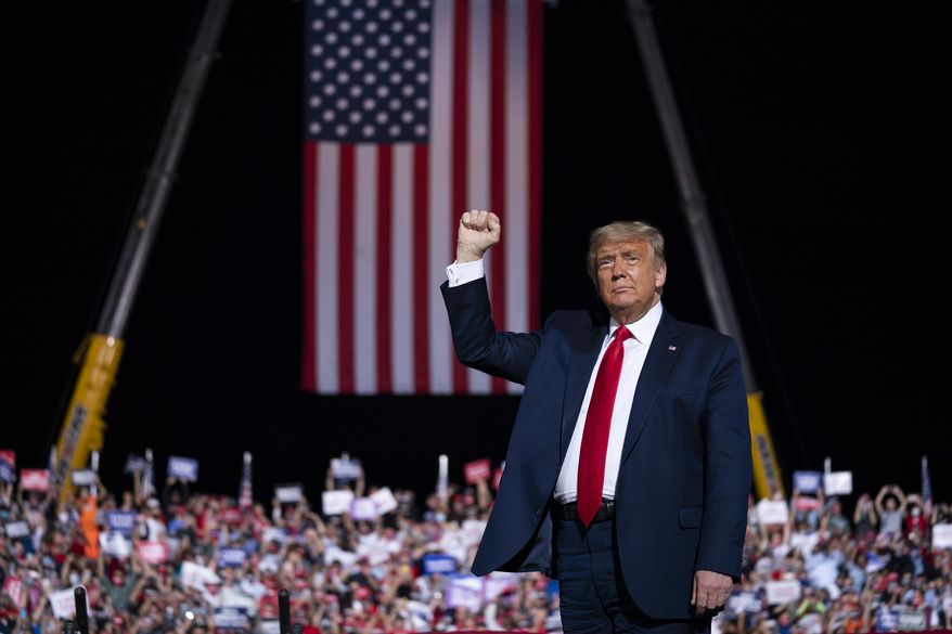 President Donald Trump arrives for a campaign rally at Gastonia Municipal Airport, Wednesday, Oct. 21, 2020, in Gastonia, N.C. (AP Photo/Evan Vucci)