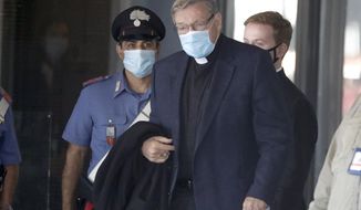 Australian Cardinal George Pell arrives at Rome&#39;s international airport in Fiumicino, Wednesday, Sept. 30, 2020. Pell took a leave of absence from his job in 2017 to stand trial in his native Australia on historic child sexual abuse charges, for which he was ultimately acquitted. (AP Photo/Andrew Medichini)