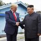 In this June 30, 2019, file photo, President Donald Trump shakes hands with North Korean leader Kim Jong-un at the border village of Panmunjom in the Demilitarized Zone, South Korea. (AP Photo/Susan Walsh, File)