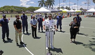 FILE - In this Aug. 27, 2020 file photo U.S. Surgeon General Vice Adm. Jerome Adams speaks during a press conference on the second day of surge COVID-19 testing, at Kalakaua District Park in Honolulu. Adams who was cited for being in a closed Hawaii park in August while in the islands helping with surge testing amid a spike in coronavirus cases, appears for a virtual arraignment in a Hawaii court on Wednesday, Oct. 21, 2020. (Jamm Aquino/Honolulu Star-Advertiser via AP,File)