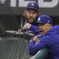 Los Angeles Dodgers manager Dave Roberts and starting pitcher Clayton Kershaw watch batting practice before Game 2 of the baseball World Series against the Tampa Bay Rays Wednesday, Oct. 21, 2020, in Arlington, Texas. (AP Photo/Sue Ogrocki)