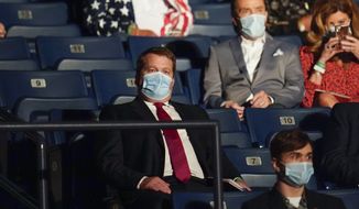 Tony Bobulinski, center seated, who says he is a former associate of Hunter Biden, waits for the start of the second and final presidential debate Thursday, Oct. 22, 2020, at Belmont University in Nashville, Tenn. (AP Photo/Julio Cortez)