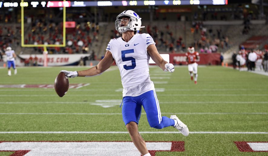 BYU wide receiver Dax Milne (5) celebrates his touchdown during the first half of an NCAA college football game against Houston, Friday, Oct. 16, 2020, in Houston. (AP Photo/Eric Christian Smith)