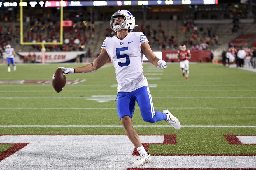 BYU wide receiver Dax Milne (5) celebrates his touchdown during the first half of an NCAA college football game against Houston, Friday, Oct. 16, 2020, in Houston. (AP Photo/Eric Christian Smith)