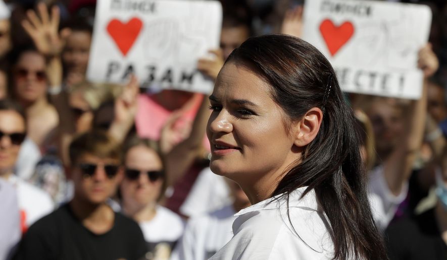 In this Sunday, Aug. 2, 2020, file photo, Sviatlana Tsikhanouskaya, candidate for the presidential elections, smiles as she speaks to people during a meeting in her support in Brest, 326 km (203,7 miles) southwest of Minsk, Belarus. The European Union has awarded its top human rights prize to the Belarus opposition movement and its leader Sviatlana Tsikhanouskaya for their challenge to President Alexander Lukashenko&#39;s long hard-line reign. (AP Photo/Sergei Grits, File)