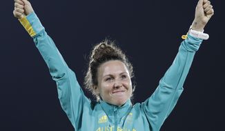 FILE - In this Aug. 19, 2016, file photo, Chloe Esposito of Australia celebrates winning the gold medal at the awards ceremony of the women&#39;s modern pentathlon at the Summer Olympics in Rio de Janeiro, Brazil. Esposito announced in late January that a “wonderful, unexpected surprise” had occurred and that the Australian wouldn’t be able to defend her modern pentathlon gold medal at the Tokyo Olympics. She was pregnant with her first child. Two months later Esposito and thousands of other Olympic athletes learned that the Tokyo Games would be put off by a year until July 2021 because of the coronavirus pandemic. While for some it meant more time to recover from injuries or extra time to prepare, Esposito realized it might give her a second chance to be in Tokyo next year. (AP Photo/Natacha Pisarenko, File)