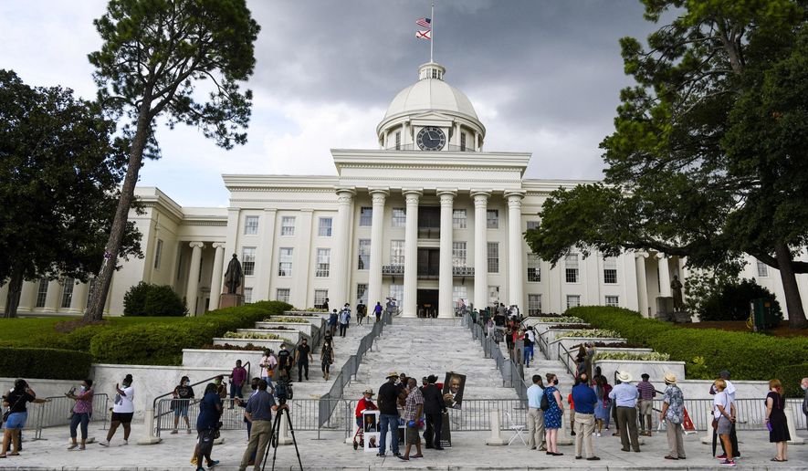FILE - In this July 26, 2020, file photo, mourners gathered at the Alabama Capitol following the death of Rep. John Lewis. Alabama voters will decide whether to remove racist, segregation-era language from the state's 1901 Constitution in the upcoming election. If approved, the measure would go back to legislators and another statewide vote. (AP Photo/Julie Bennett, File)