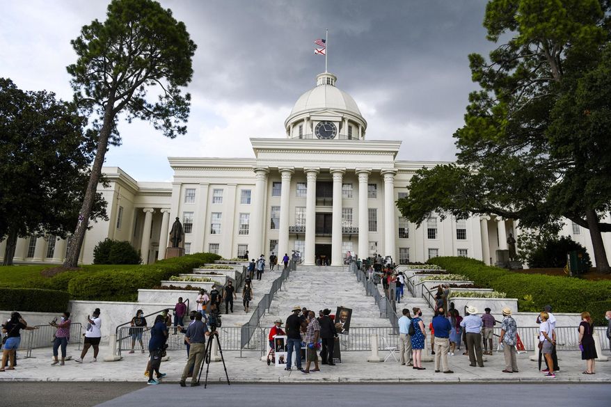 FILE - In this July 26, 2020, file photo, mourners gathered at the Alabama Capitol following the death of Rep. John Lewis. Alabama voters will decide whether to remove racist, segregation-era language from the state's 1901 Constitution in the upcoming election. If approved, the measure would go back to legislators and another statewide vote. (AP Photo/Julie Bennett, File)