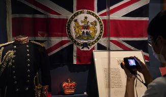The standard and uniform of the former British Governors of Hong Kong, are displayed at the exhibition &amp;quot;The Hong Kong Story&amp;quot; in the Hong Kong Museum of History, Friday, Oct. 16, 2020. The exhibition &amp;quot;The Hong Kong Story&amp;quot; will be temporarily closed from 19 Oct 2020 for an extensive revamp. (AP Photo/Kin Cheung)