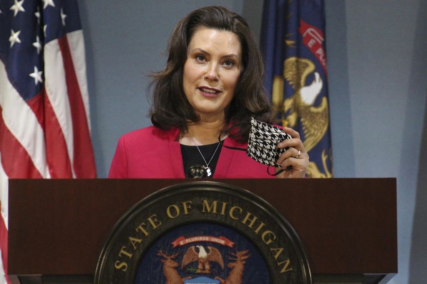 FILE - In this Thursday, May 21, 2020 file photo provided by the Michigan Office of the Governor, Michigan Gov. Gretchen Whitmer speaks during a news conference in Lansing, Mich. Gov. The Michigan Public Service Commission has some authority over Enbridge&#39;s plans to build an oil pipeline tunnel beneath the channel that connects two of the Great Lakes, a state administrative law judge ruled Friday, Oct. 23, 2020. Democratic Gov. Gretchen Whitmer has joined environmentalists and native tribes in calling for shutdown of the 67-year-old line, saying the underwater segment is vulnerable to a catastrophic rupture. (Michigan Office of the Governor via AP, Pool, File)