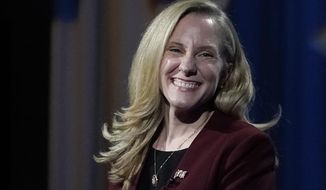 U.S. Rep. Abigail Spanberger, D-Va., smiles during a Chamber RVA sponsored candidate forum with Republican challenger Del. Nick Freitas, R-Culpeper, in Richmond, Va., Tuesday Oct. 20, 2020. Spanberger was among the historic wave of women who helped Democrats retake the U.S. House in 2018, boasting former careers with the U.S. Navy and the CIA. (AP Photo/Steve Helber)