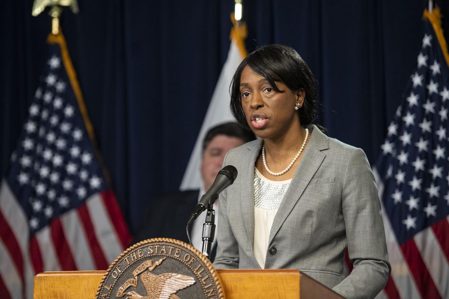 FILE - In this April 23, 2020 file photo, Dr. Ngozi Ezike, director of the Illinois Department of Public Health, speaks at Gov. J.B. Pritzker's daily Illinois coronavirus update at the Thompson Center in Chicago. The "COVID fatigue" which Dr. Ezike constantly rallies Illinois to fight against got the best of the state public health director Friday, Nov. 23, 2020, as she recited the grim statistics that continue to climb in an autumn surge of the coronavirus pandemic. (Tyler LaRiviere/Chicago Sun-Times via AP File)