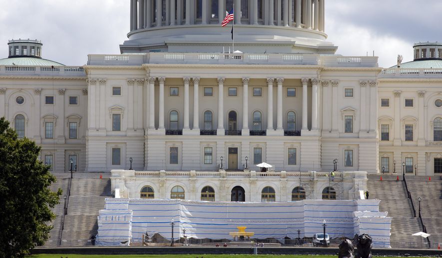 The West Front of the U.S. Capitol on Friday, Aug. 7, 2020, in Washington. While much of Washington is twisted in knots over the upcoming election, there’s another contingent already busy trying to figure out how to stage an inauguration for the next president during a pandemic. (AP Photo/Jon Elswick)