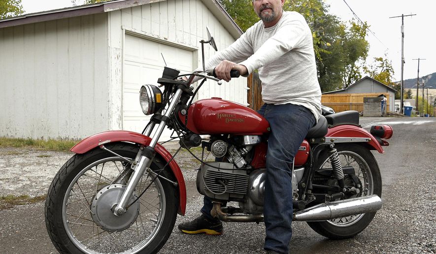 Miles McCarvel sits on his 1972 Aermacchi Harley-Davidson 350 Sprint in Missoula, Mont. on Oct. 19, 2020. The motorcycle was stolen from his garage four years ago and returned to him last week. McCarvel said he doesn&#x27;t know who took the motorcycle, where it was the last four years, or who returned it and why, but the bike was in exactly the same condition as when it was stolen. (Tom Bauer/Missoulian via AP)