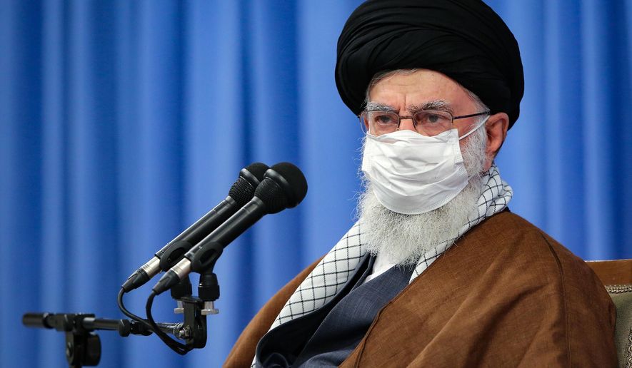 In this picture released by the official website of the office of the Iranian supreme leader, Supreme Leader Ayatollah Ali Khamenei, wearing a mask to protect against COVID-19, attends a meeting with National Corona Headquarters, in Tehran, Iran, Saturday, Oct. 24, 2020. (Office of the Iranian Supreme Leader via AP)