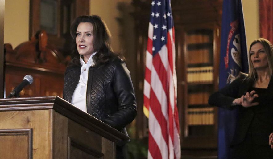 FILE - In an Oct. 8, 2020 file photo provided by the Michigan Office of the Governor, Michigan Gov. Gretchen Whitmer addresses the state during a speech in Lansing, Mich. The governor delivered remarks addressing Michiganders after the Michigan Attorney General, Michigan State Police, U.S. Department of Justice, and FBI announced state and federal charges against 13 members of two militia groups who were preparing to kidnap and possibly kill the governor. (Michigan Office of the Governor via AP File)