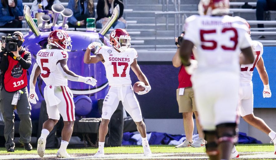 Oklahoma Sooners wide receiver Marvin Mims (17) celebrates scoring a touchdown during the first half of an NCAA College football game against TCU, Saturday, Oct. 24, 2020, in Fort Worth, Texas. (AP Photo/Brandon Wade)