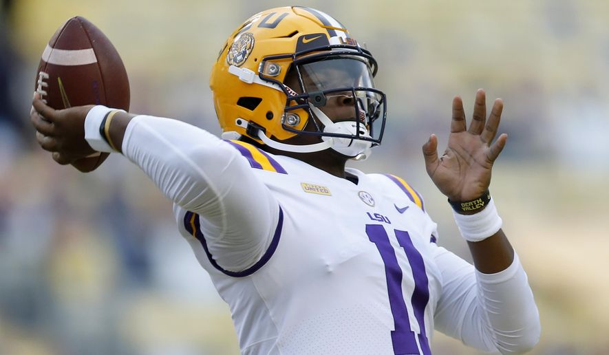 LSU quarterback TJ Finley (11) warms up before an NCAA college football game against South Carolina in Baton Rouge, La. Saturday, Oct. 24, 2020. (AP Photo/Brett Duke)