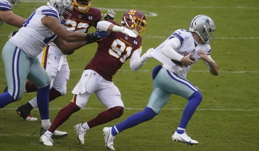 Dallas Cowboys quarterback Ben DiNucci (7) is tackled by Washington Football Team defensive end Ryan Kerrigan (91) in the second half of an NFL football game, Sunday, Oct. 25, 2020, in Landover, Md. Washington won 25-3. (AP Photo/Al Drago)