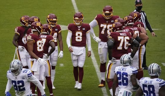 Washington Football Team quarterback Kyle Allen (8) before the start of the first half of an NFL football game against Dallas Cowboys, Sunday, Oct. 25, 2020, in Landover, Md. (AP Photo/Al Drago)