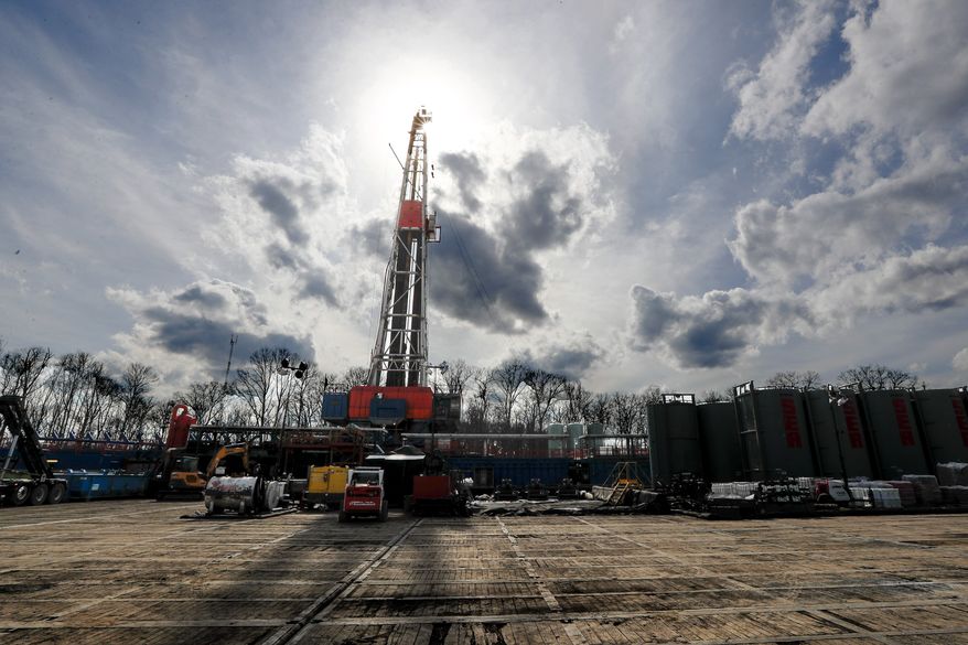 In this March 12, 2020, file photo, the sun shines through clouds above a shale gas drilling site in St. Mary's, Pa. In a late gambit to win the battleground state of Pennsylvania, President Donald Trump and his GOP allies have intensified attacks on Joe Biden over fracking, hoping to drive a wedge between the former vice president and the white, working-class voters tied to the state's booming natural gas industry. (AP Photo/Keith Srakocic, File)