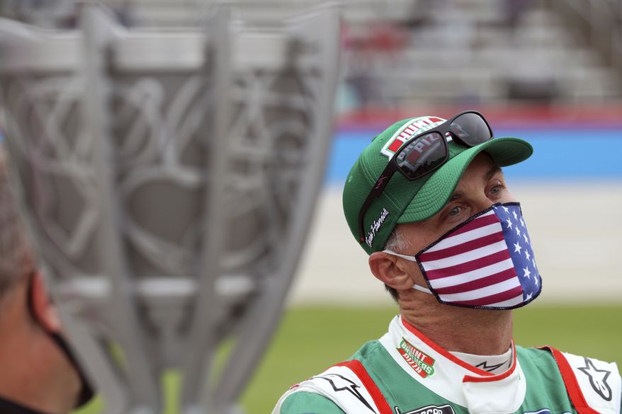 Kevin Harvick (4) waits on the grid before a NASCAR Cup Series auto race at Texas Motor Speedway in Fort Worth, Texas, Sunday, Oct. 25, 2020. (AP Photo/Richard W. Rodriguez)