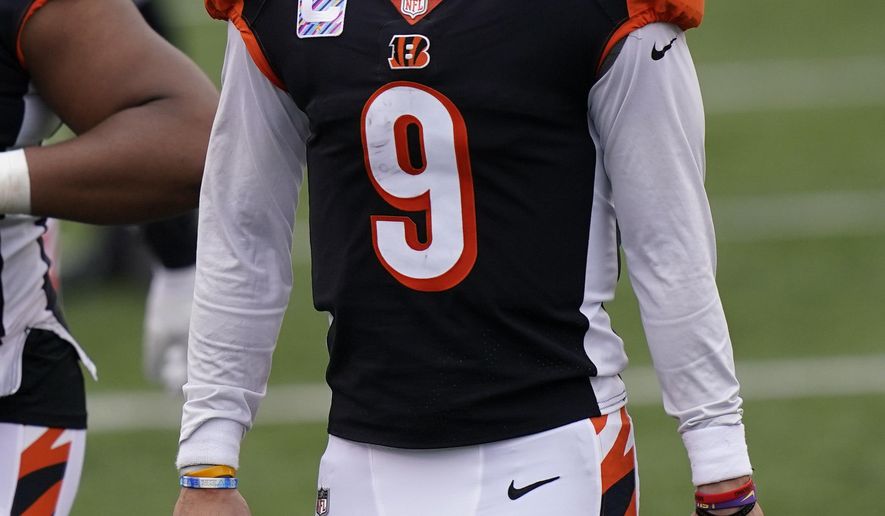 Cincinnati Bengals quarterback Joe Burrow (9) walks off the field following an NFL football game against the Cleveland Browns, Sunday, Oct. 25, 2020, in Cincinnati. (AP Photo/Bryan Woolston)