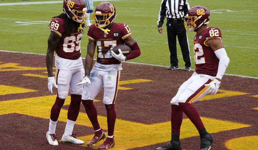 Washington Football Team wide receiver Terry McLaurin (17) celebrates his touchdown with teammates wide receiver Cam Sims (89) and tight end Logan Thomas (82) in the first half of an NFL football game against Dallas Cowboys, Sunday, Oct. 25, 2020, in Landover, Md. (AP Photo/Patrick Semansky)