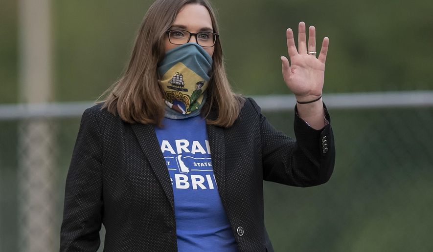 FILE - In this Tuesday, Sept. 15, 2020 file photo, transgender activist Sarah McBride, who hopes to win a seat in the Delaware Senate, campaigns at the Claymont Boys & Girls Club in Claymont, Del. McBride, who has long-standing ties to Delaware’s best-known political family, says, “I am very aware of the stark contrast between the president we could have (Biden) and the president we now have. ... There has never been a moment in the fight for trans equality with such potential and at the same time such risk.” (AP Photo/Jason Minto)