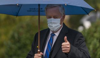White House chief of staff Mark Meadows gestures as he responds to reporters questions outside the West Wing on the North Lawn of the White House, Sunday, Oct. 25, 2020, in Washington. (AP Photo/Manuel Balce Ceneta)
